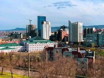 High angle view of buildings in city against sky