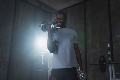 Rear view of man standing in gym