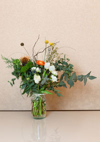 A beautiful elegant designer airy winter bouquet of flowers with christmas decorations