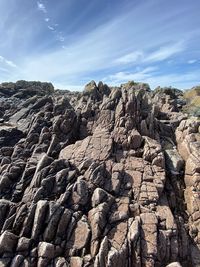 Rock formation on land against sky