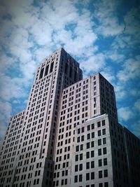 Low angle view of tall buildings against sky