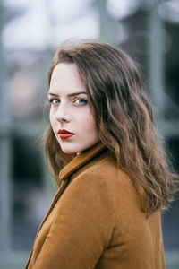 Portrait of young beautiful woman with blue eyes