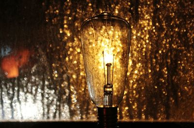 Close-up of illuminated light bulb