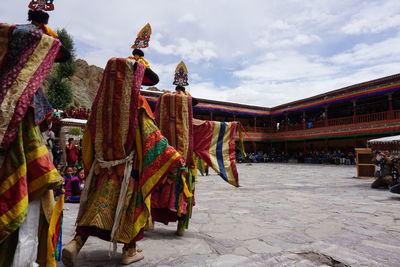 Clothes hanging outside temple against sky