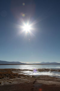 Sun shining over sea