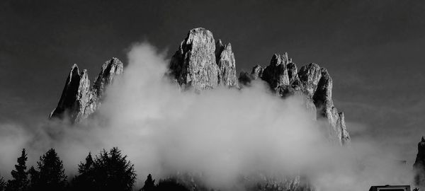 Low angle view of waterfall against sky