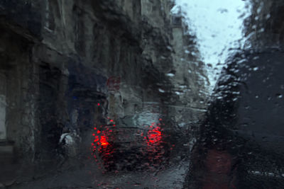 Wet car window in rainy season