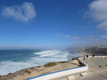 Scenic view of sea against blue sky