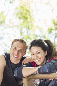 Portrait of happy multi-ethnic couple at outdoor gym