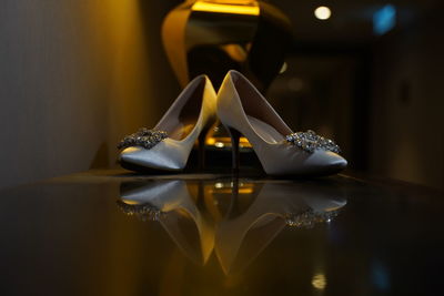 Close-up of shoes on table