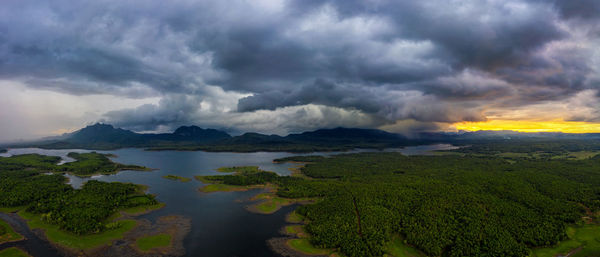 Scenic view of sea against storm clouds