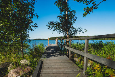 Pier over lake against sky