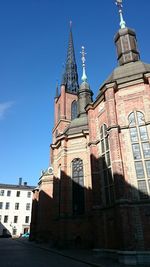 Low angle view of church against blue sky