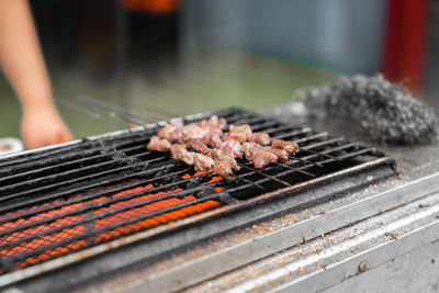 Close-up of meat on barbecue grill