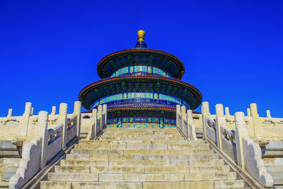 Low angle view of historical building against blue sky