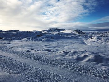 Scenic view of snowcapped mountains against sky