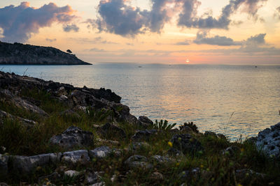 Scenic view of sea against sky during sunset