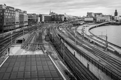 High angle view of railroad tracks amidst buildings in city