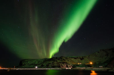 Scenic view of landscape against sky at night