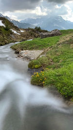 Scenic view of stream against sky