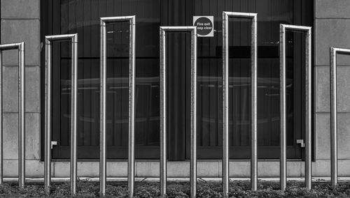 Closed metal fence against building