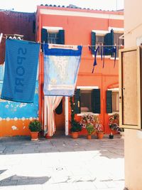 View of clothesline next to houses