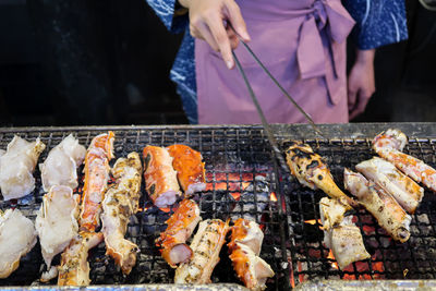 Low angle view of meat on barbecue grill