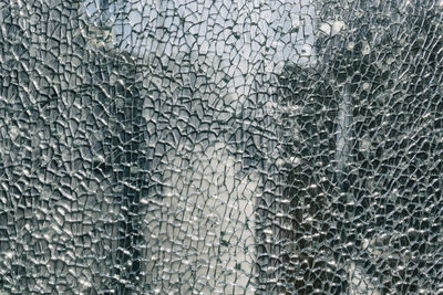 Full frame shot of broken glass window
