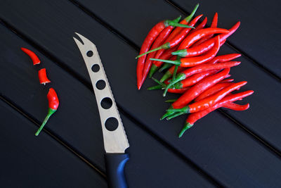 High angle view of red chili peppers on table