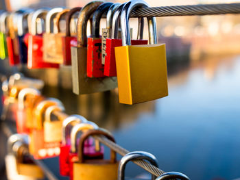 Close-up of padlocks on railing