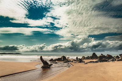 Scenic view of beach against sky