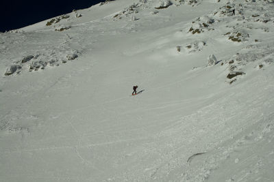 Person skiing on snow covered land