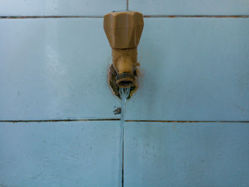 Low angle view of electric lamp on wall