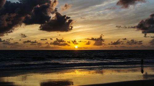 Scenic view of sea at sunset