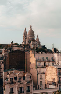 View of buildings in city against sky