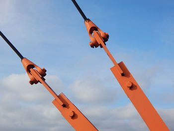 Low angle view of communications tower against sky during sunset