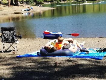 People sitting on boat at beach