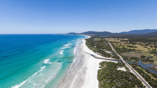 Aerial view of denison beach, denison river and the a3 highway near bicheno, tasmania, australia.