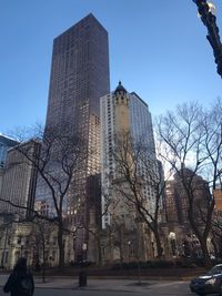 Modern city against clear blue sky