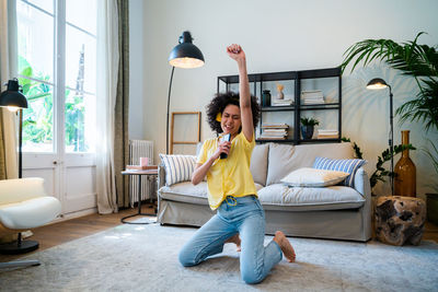 Young woman dancing at home