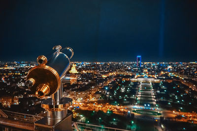 Illuminated cityscape against sky at night