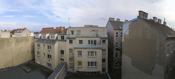 High angle view of residential buildings against sky