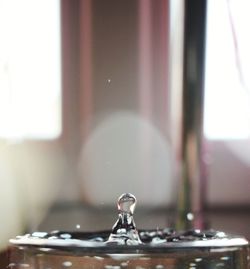 Close-up of glass window on table at home