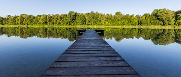 Scenic view of lake against trees