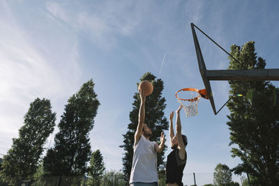 Men playing basketball