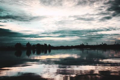 Scenic view of lake against sky during sunset