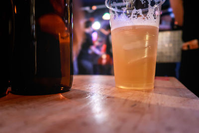 Close-up of beer glass on table