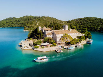 Scenic view of bay against clear sky