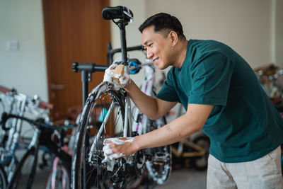 Man holding bicycle