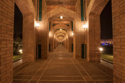 Empty illuminated corridor of building